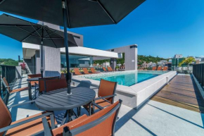 Adra 206 - Apartamento no centro de Bombinhas - Rooftop com piscina e academia - À poucos metros da praia